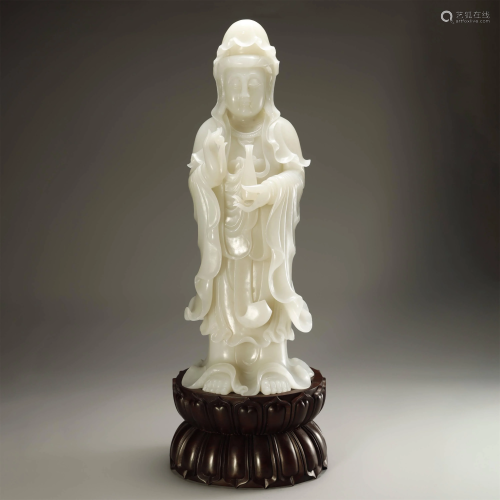 A MAGNIFICENT CARVED WHITE JADE FIGURE …