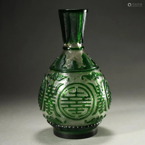 A VERY FINE CARVED GREEN GLASS VASE