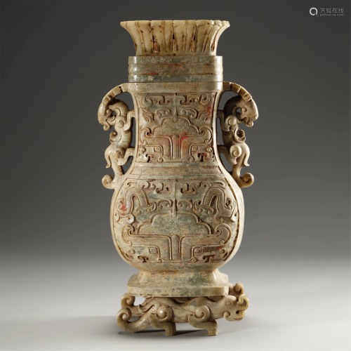 AN ARCHAIC WHITE AND RUSSET JADE VASE AND …
