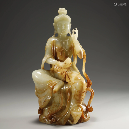 A WHITE AND RUSSET JADE GUANYIN