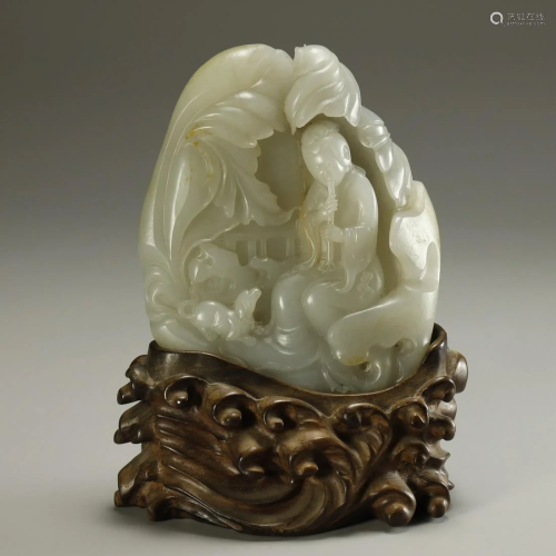 A MAGNIFICENT CARVED WHITE JADE FIGURE …