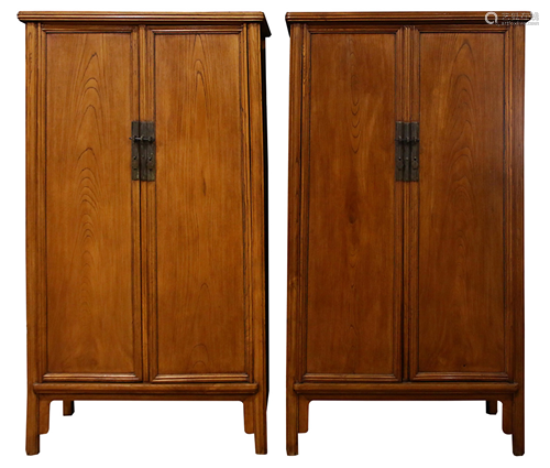 A pair of elm cabinets