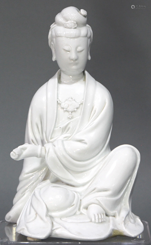 A Chinese Seated DeHua GuanYin Figure