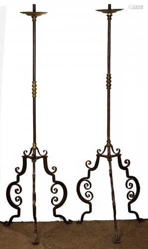 A pair of Spanish Revival wrought iron torchieres