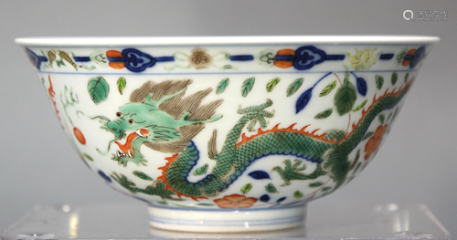 A Chinese Blue and White Wucai Dragon Bowl wi…