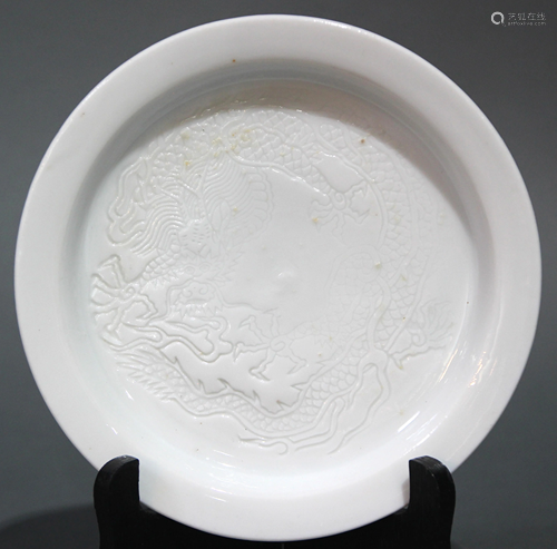 A Chinese white glaze carving dragon dish