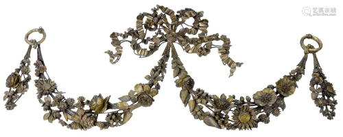 A carved and gilt floral decorated swag form mount
