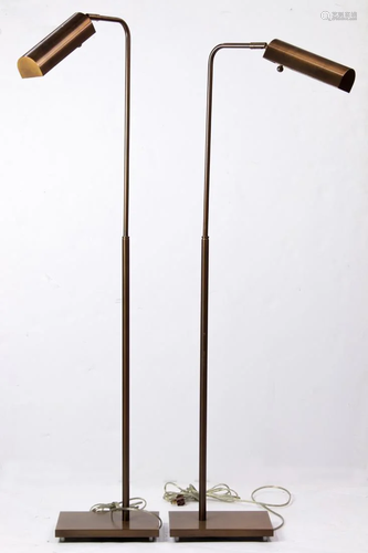 A pair of Contemporary brass adjustable floor lamps