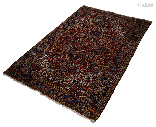 A Persian Heriz carpet