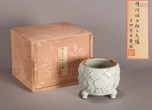 A CHINESE WHITE GLAZED TRIPOD CENSER, MI…