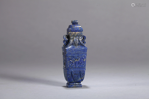 A CHINESE CARVED LAPIS 'TAOTIE MASK' VASE, Q…