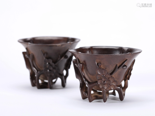 A PAIR OF CHINESE CARVED ZITAN LOBED RIM C…