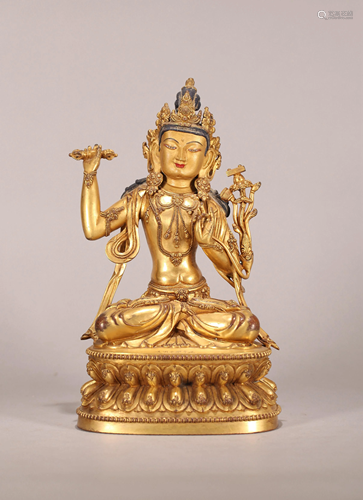 A SINO-TIBETAN GILT BRONZE FIGURE OF VAJRADH…