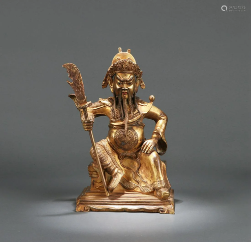 A CHINESE GILT BRONZE FIGURE OF GUANDI…