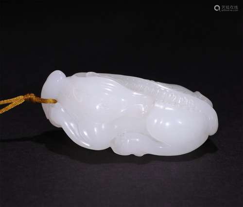 A CHINESE CARVED SUET WHITE JADE ORNAMENT