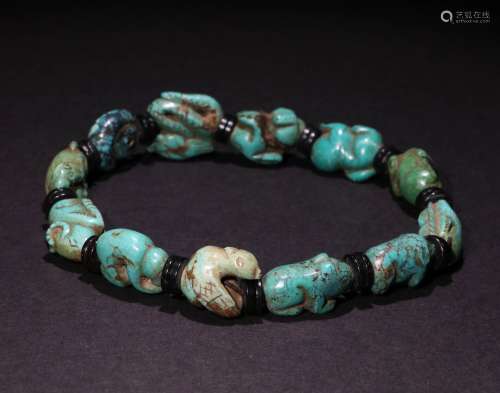 A CHINESE TURQUOISE HAND STRING