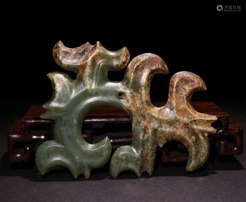 A CHINESE RED MOUNTAIN RIVER GRINDING JADE