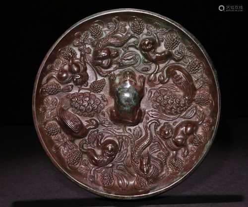 A CHINESE BRONZE MIRROR