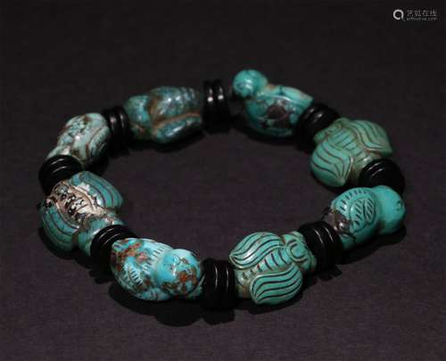 A CHINESE TURQUOISE HAND STRING