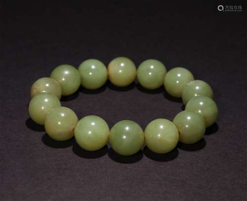 A CHINESE HETIAN JADE HAND STRING