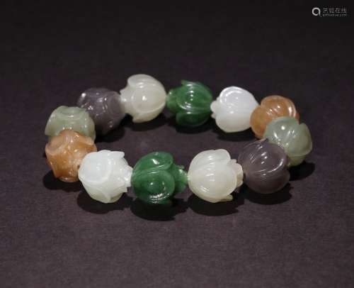 A CHINESE HETIAN JADE HAND STRING