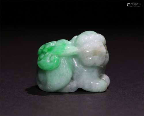 A CHINESE GREEN JADE CARVING