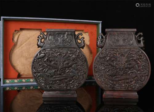 A PAIR OF CHINESE AGARWOOD BOTTLES CARVED WITH DRAGON