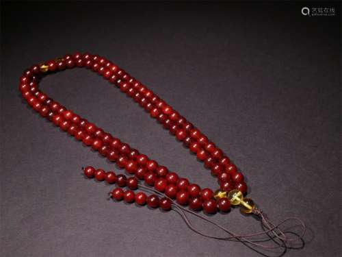 A STRING OF QING DYNASTY BEEWAX 108 BEADS