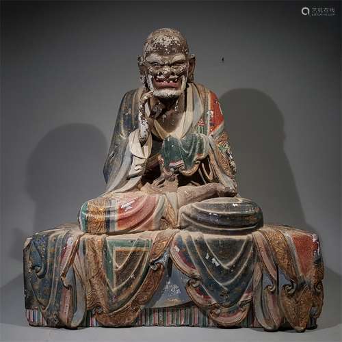 A MING DYNASTY CLAY PAINTED ARHAT STATUE