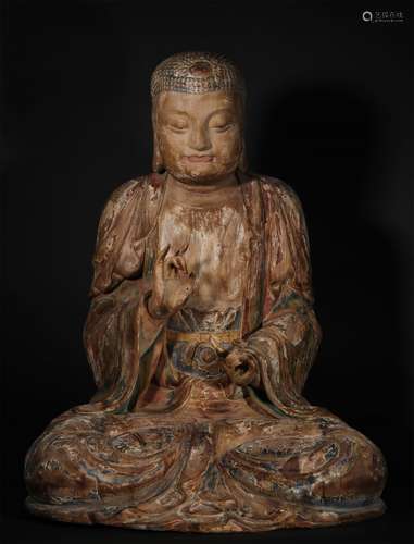 A TANG DYNASTY WOOD CARVING SAKYAMUNI