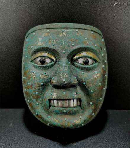 A WARRING STATES PERIOD BRONZE MASK WITH GOLD AND SILVER INLAID