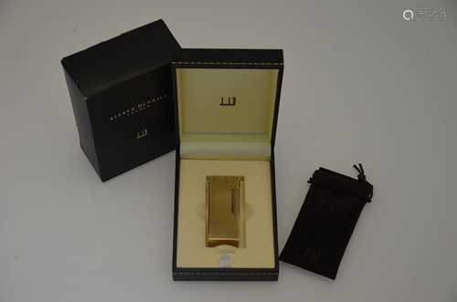 Dunhill - A 9ct yellow gold cigarette lighter of brick