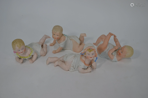 Four German bisque figures of toddlers