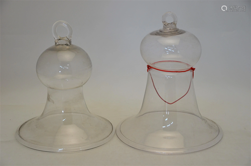 Two pairs of graduated bell-shaped glass cloches with