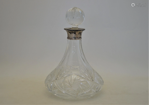 A cut glass ship's decanter with silver collar