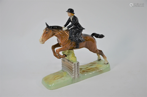 Beswick, showjumper seated side saddle clearing, a