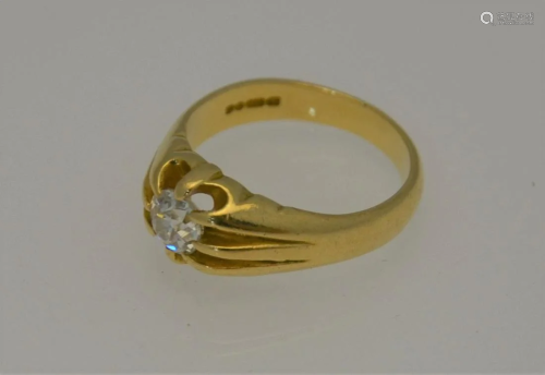 An 18ct yellow gold ring with single claw set brilliant
