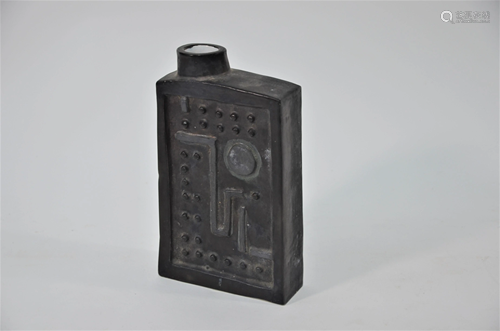 A Troika black-glazed slab bottle