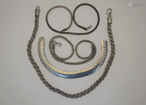 A collection of white metal items