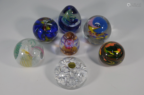 Six various glass paperweights