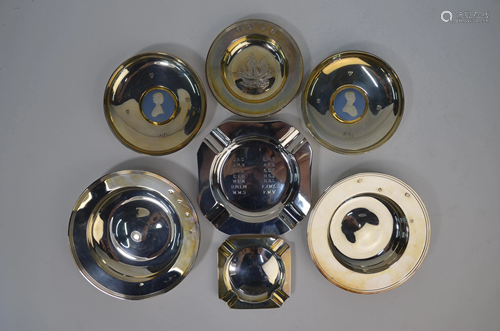 A collection of various silver dishes