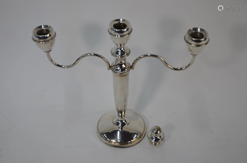 A pair of silver twin branch candelabra