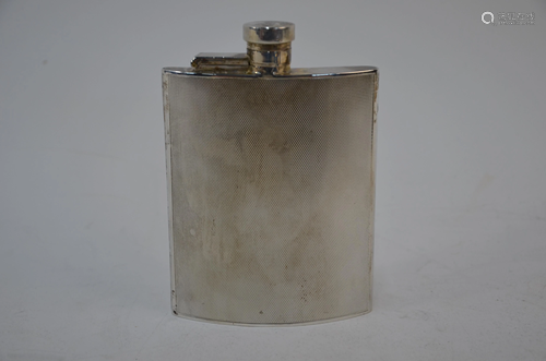 An engine-turned silver hip-pocket flask