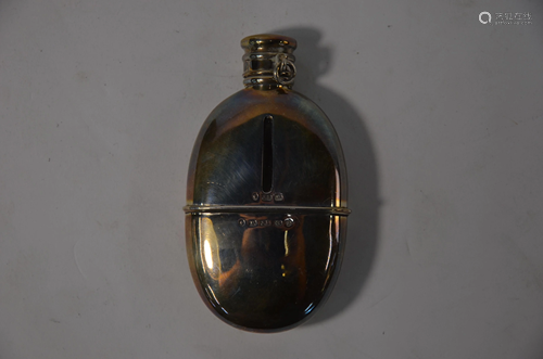 A Victorian silver-clad oval hip-flask