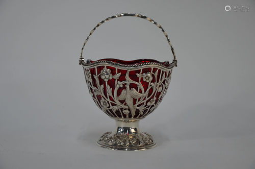 A Victorian pierced silver bonbon basket with swing