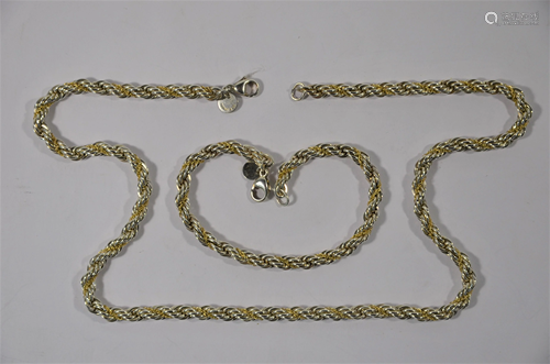 Tiffany & Co - A white and yellow metal rope style