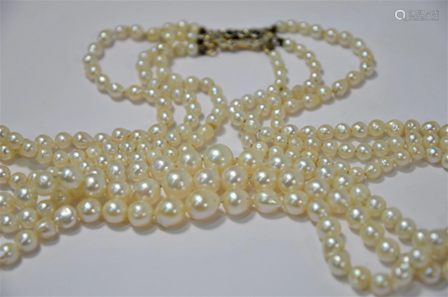 A three row graduated pearl necklace