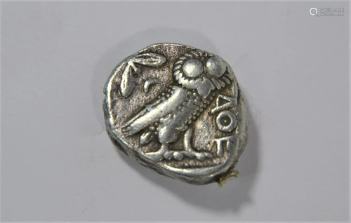 A coin in the manner of an Ancient Greek coin