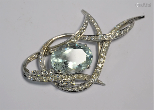 An aquamarine and diamond set brooch/pendant