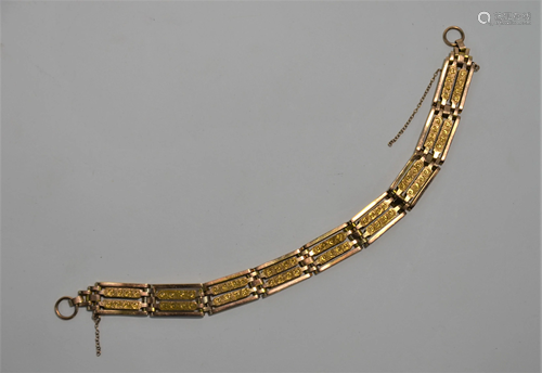 A yellow metal gatelink bracelet